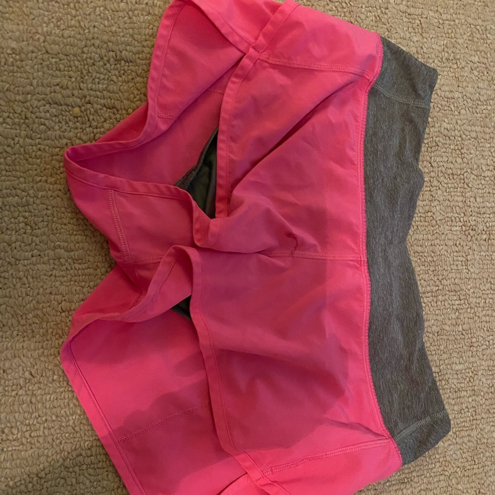 pink lulu lemon shorts with grey wristband